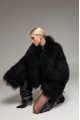 Women's short black fur coat made of natural llama fur